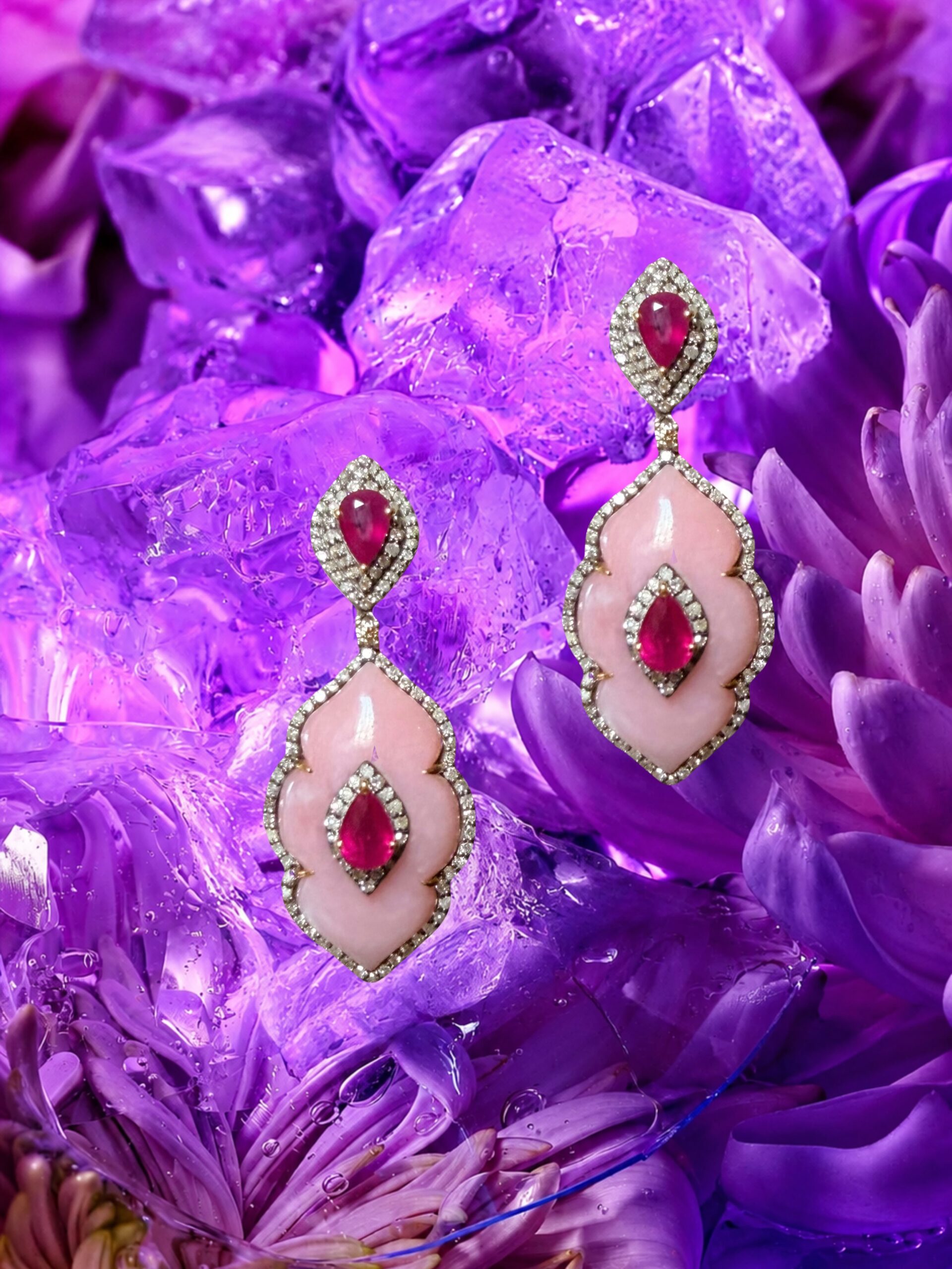 Ganesha Earrings from the Mahabharata Collection by @dakinijewellery bring together the luminous blush of pink opal, the deep fire of rubies, and the timeless brilliance of diamonds.

Inspired by Ganesha, one of the most revered deities in the Indian pantheon, these earrings embody the energy of wisdom, prosperity and new beginnings. Known as the remover of obstacles and the guardian of auspicious beginnings, Ganesha is traditionally invoked before embarking on a new journey — making these earrings not only a statement of beauty, but a symbol of grace and possibility.

#pinkopal #rubyearrings #diamonds #dakinijewellery #fantasyjewelry